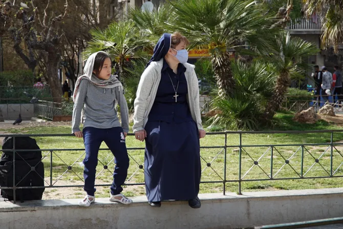 Sr. Victoria Kovalchuk with a refugee girl in Athens, Greece.